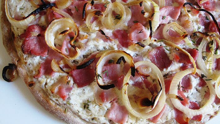 German Flammkuchen Pizza with onions and bacon